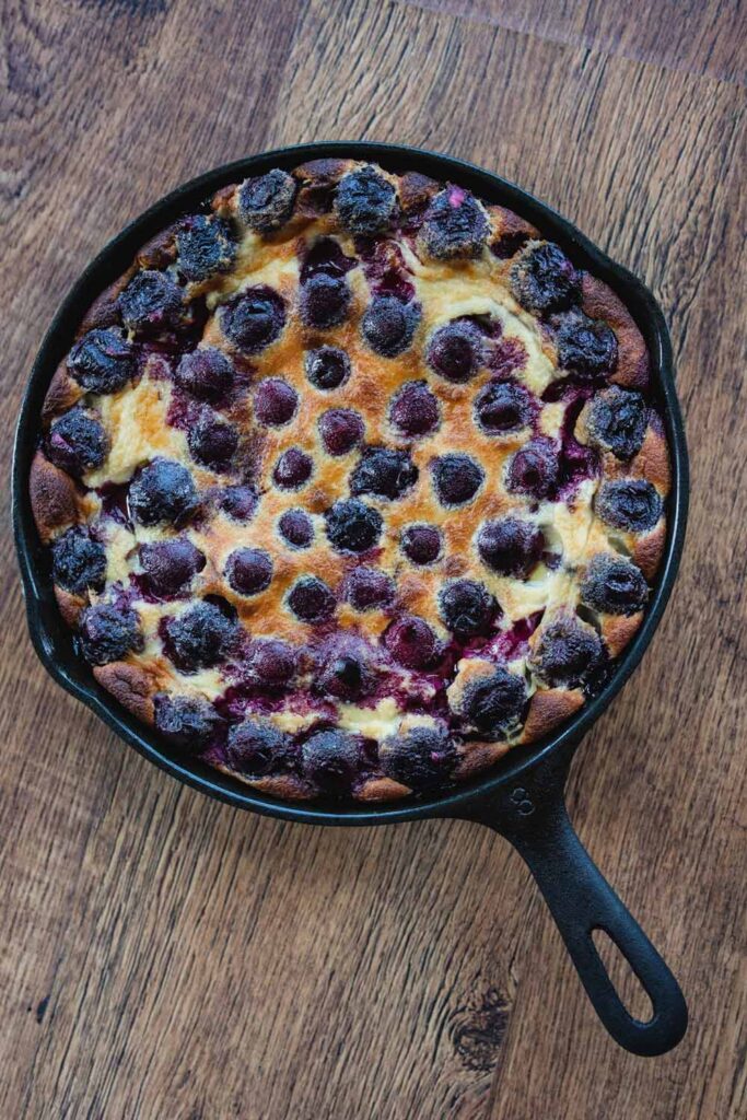 cherry clafoutis in a cast iron pan