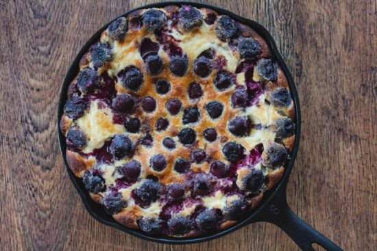 cherry clafoutis in a cast iron skillet