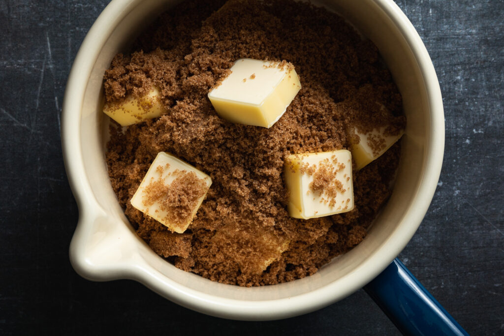 butter and dark brown sugar in a small enameled saucepan
