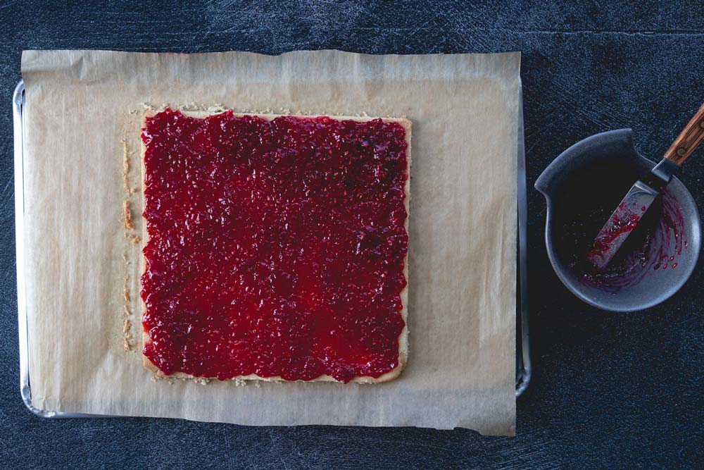 fill the shortcrust with raspberry jam