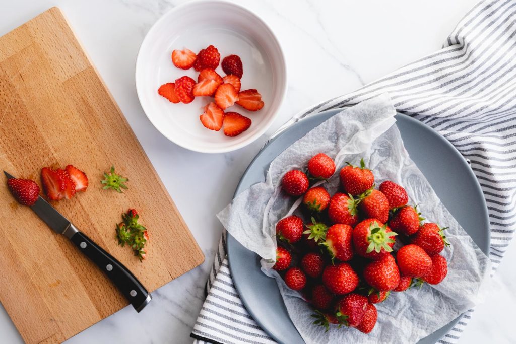 Prepping the balsamic macerated strawberries