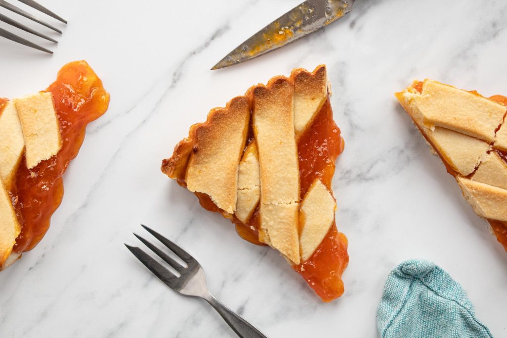 slices of apricot jam crostata
