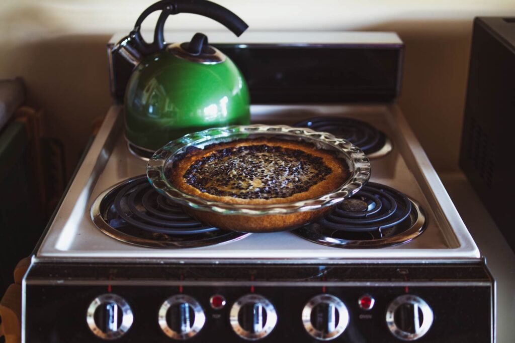 mustikkapiirakka finnish blueberry tart cooling on the stove