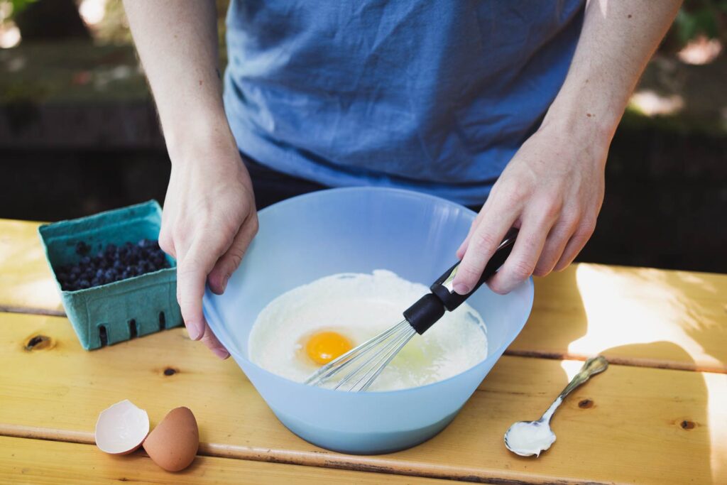 mixing the creme fraiche filling for mustikkapiirakka