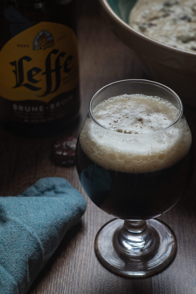 glass of leffe bruin and oliebollen dough