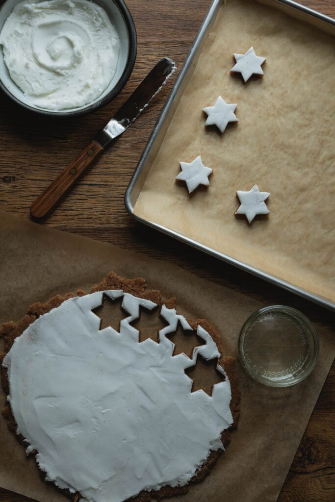 cutting out zimtsterne cinnamon star cookies