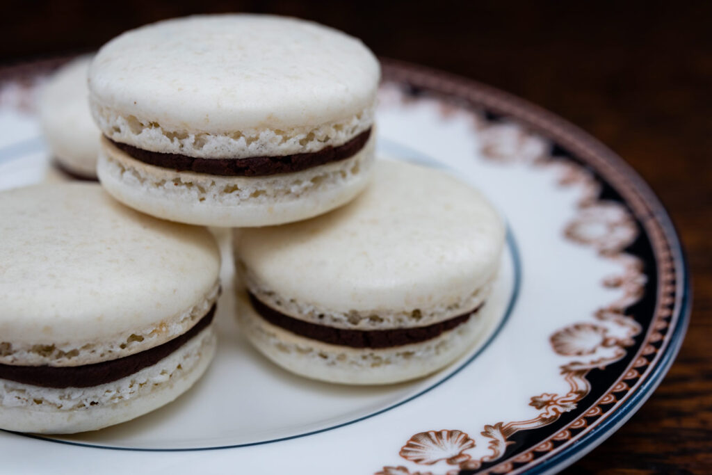 macarons stacked on a porcelain plate