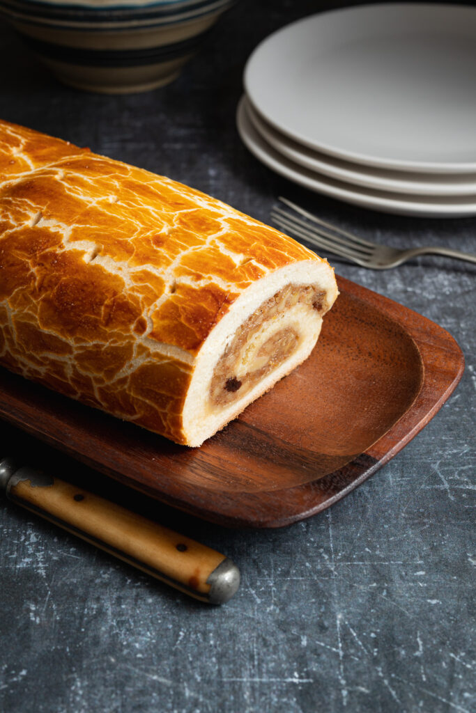 bejgli diós hungarian walnut roll on a wooden dish