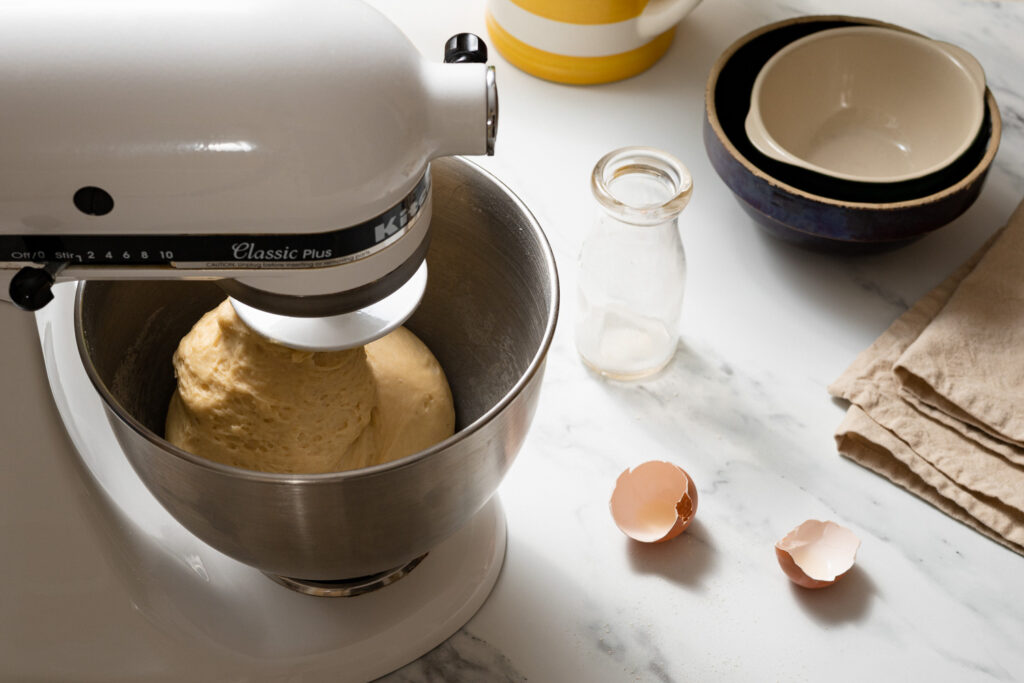kneading zeeuwse bolus dough in a white Kitchen-aid mixer