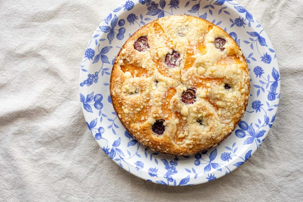 bublanina coffee cake on a blue floral plate on a linen tablecloth