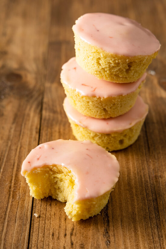 a stack of Dutch pink cakes on a wooden table