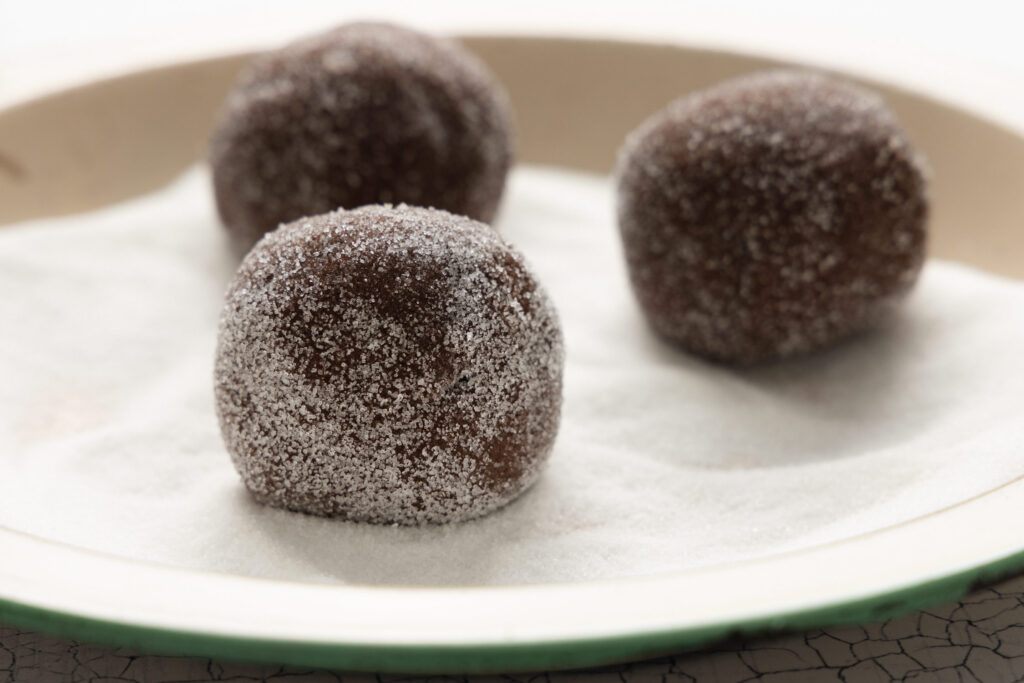 chocolate buckwheat cookie dough balls coated in granulated sugar