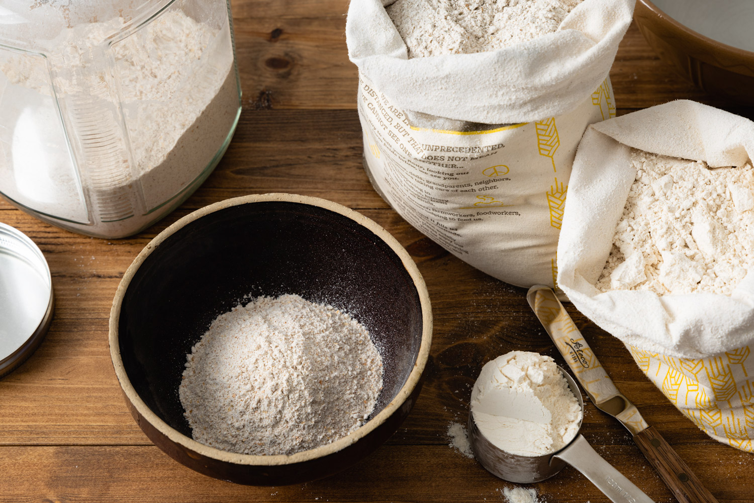 different types of flour on a wooden table