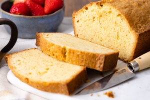 Brown butter pound cake, sliced, on a marble tray