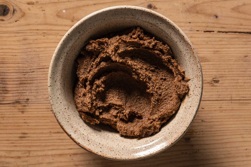 An overhead photo of the cinnamon filling in a small ceramic bowl