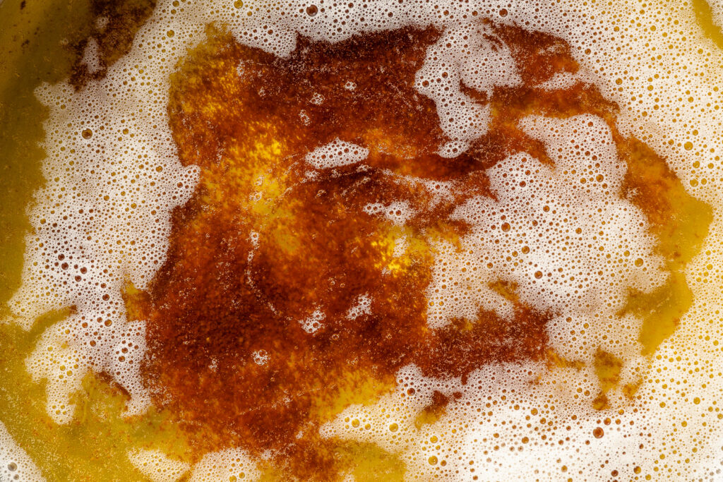 Close up of dark amber brown butter